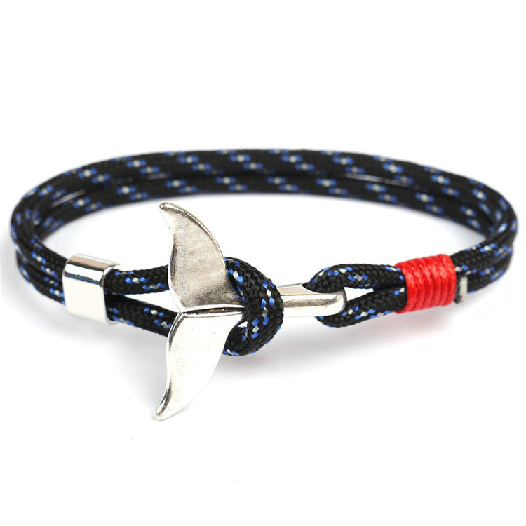 a bracelet with a silver metal object on it