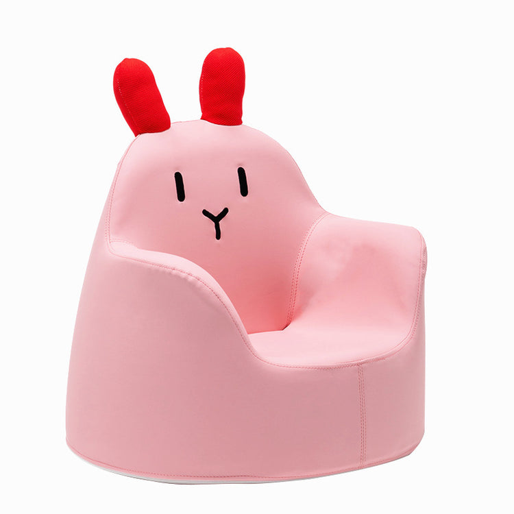 a pink chair with a face