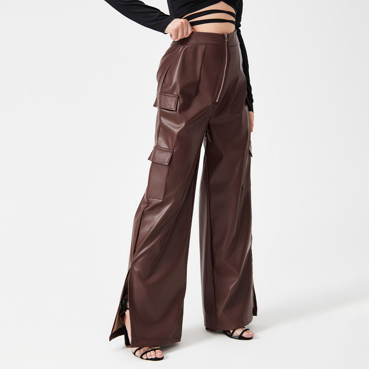 a woman wearing a black top and brown pants
