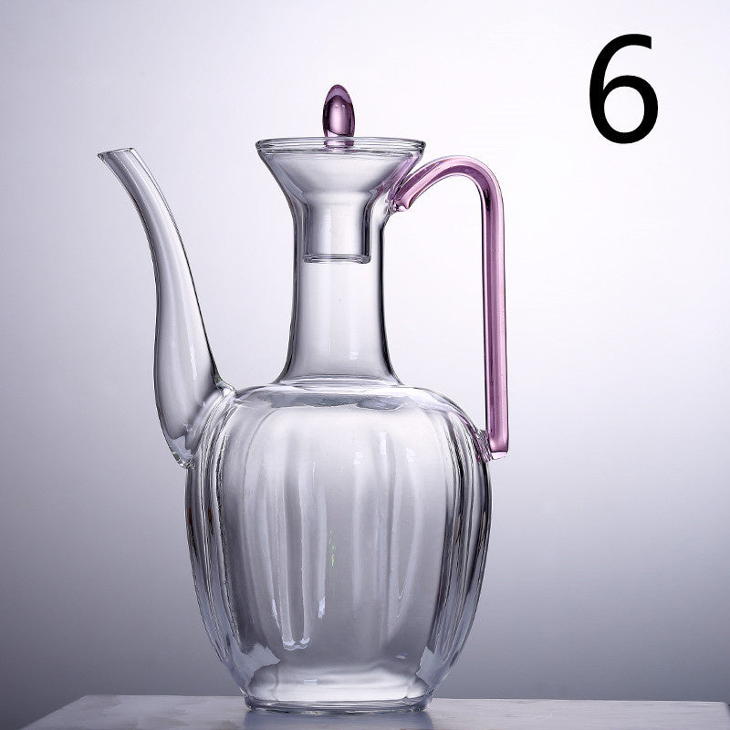 a glass jug with a handle
