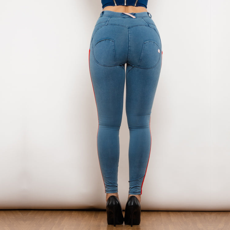 a woman wearing blue jeans