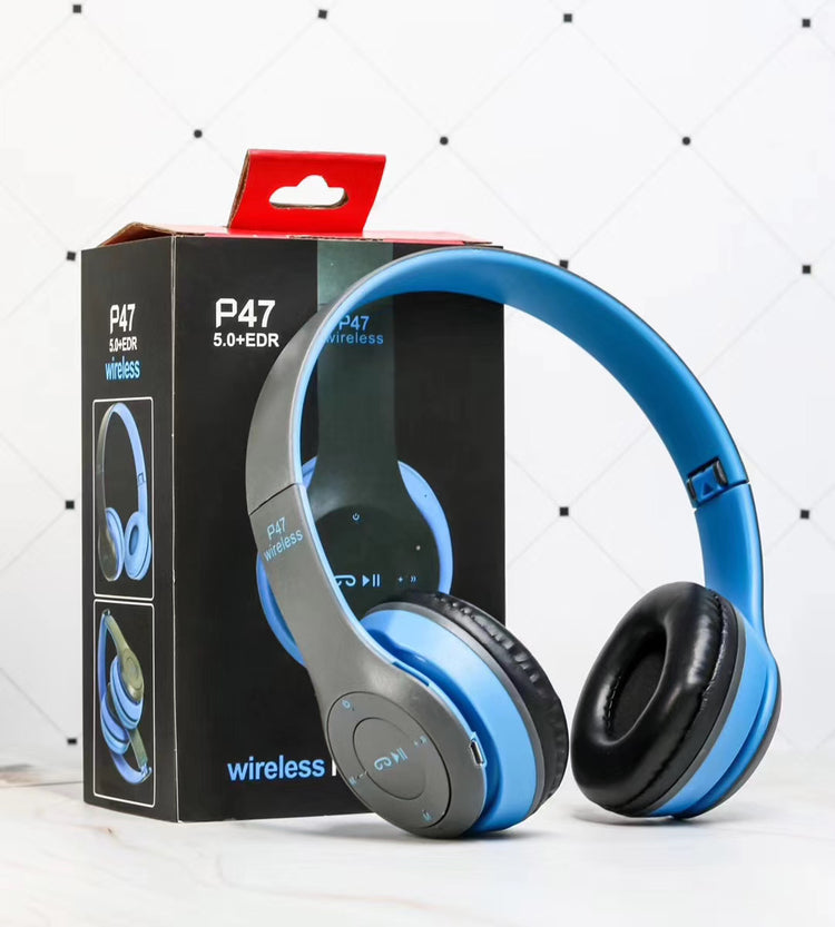 a blue and black headphones in a box