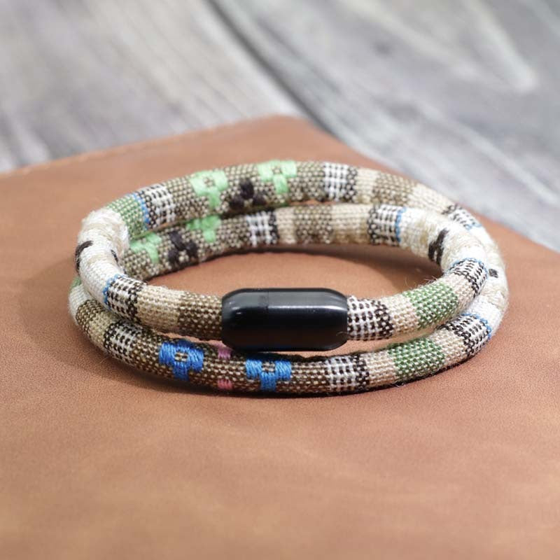 a bracelet on a book