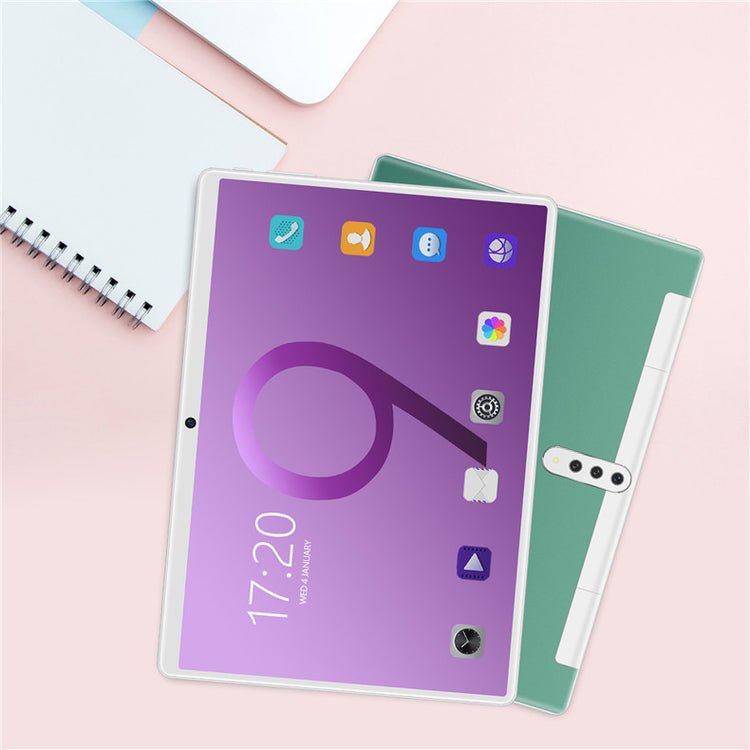 a tablet and notebook on a table