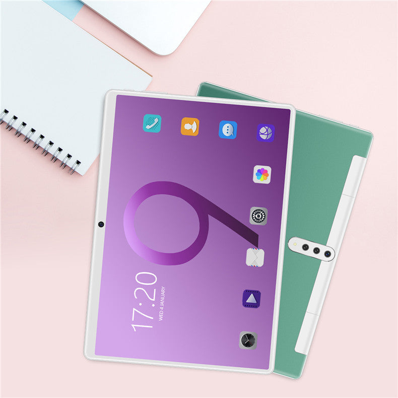 a tablet and notebook on a table