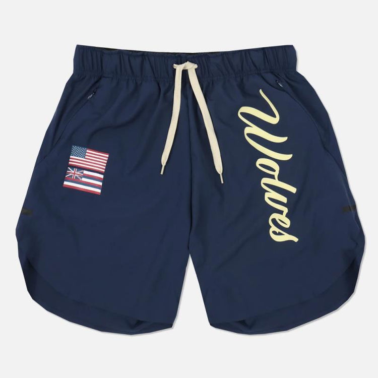a pair of blue shorts with a flag patch