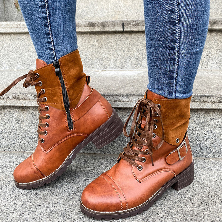 a person's legs and boots on steps