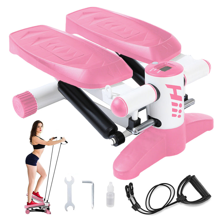 a pink exercise machine with a woman standing next to it