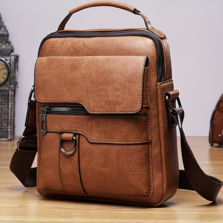 a brown leather bag on a wood floor