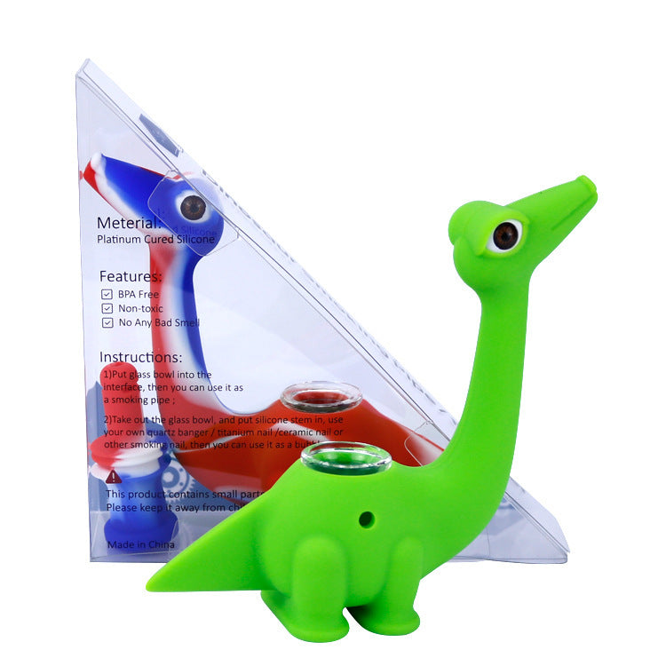 a green dinosaur smoking pipe