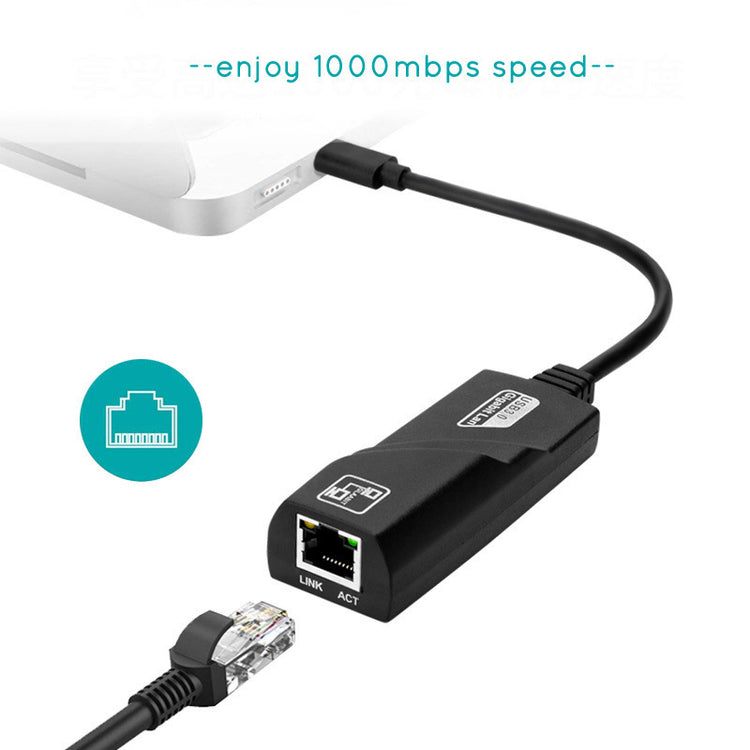a black cable connected to a laptop