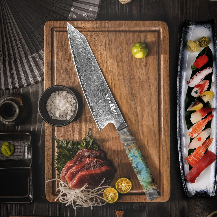 a knife on a cutting board next to a plate of food