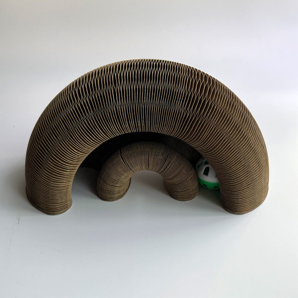 a cardboard arch with a ball inside