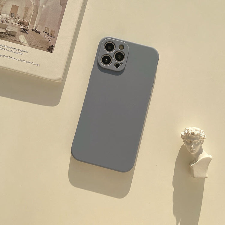 a phone and a book on a table