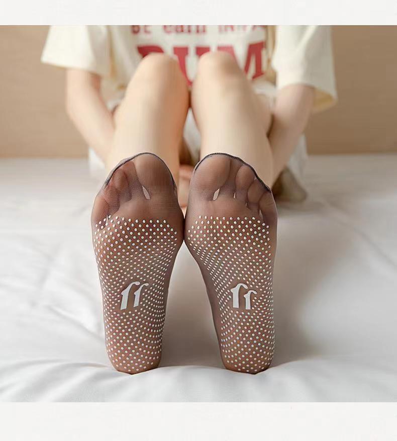 a person's feet with white dots on them