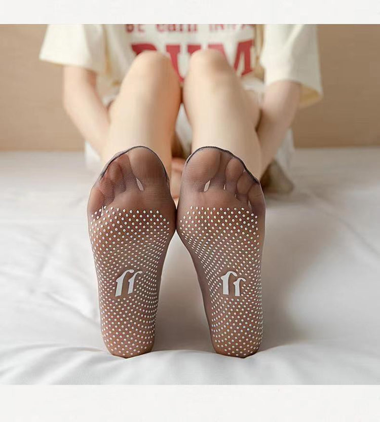 a person's feet with white dots on them
