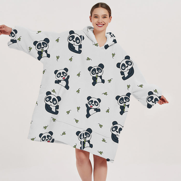 a woman wearing a panda blanket