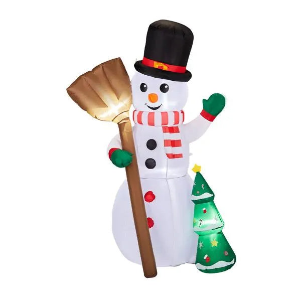 a snowman with a shovel and a tree