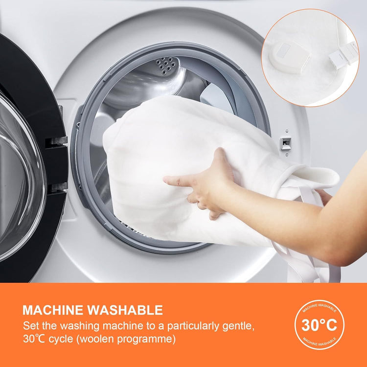 a person holding a white towel in a washing machine