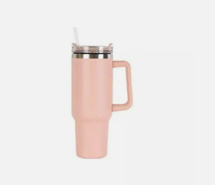 a pink mug with a straw
