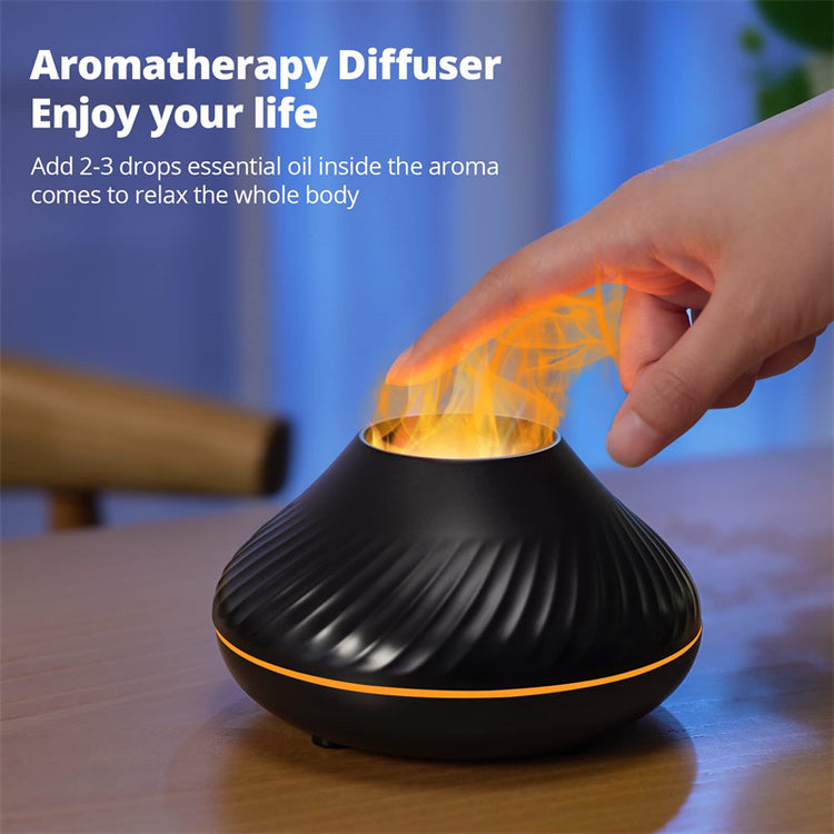 a hand touching a black object with flames