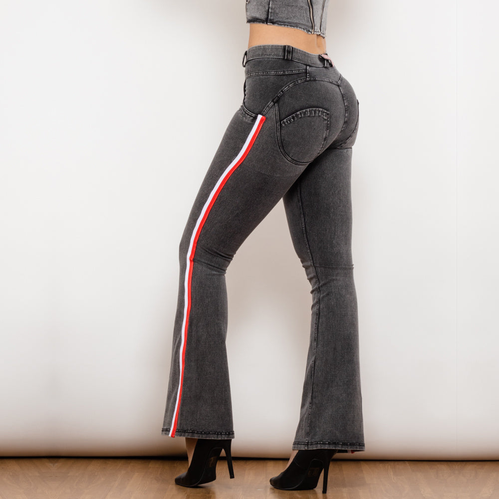 a woman wearing jeans and heels
