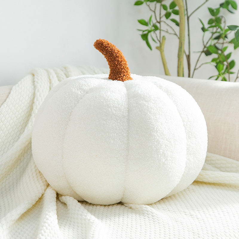 a white pumpkin on a white blanket