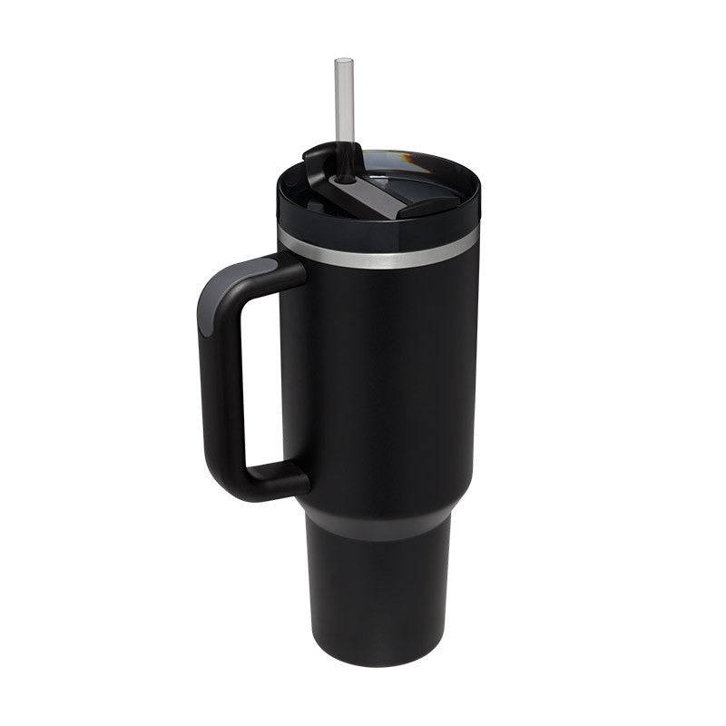 a black coffee mug with a straw