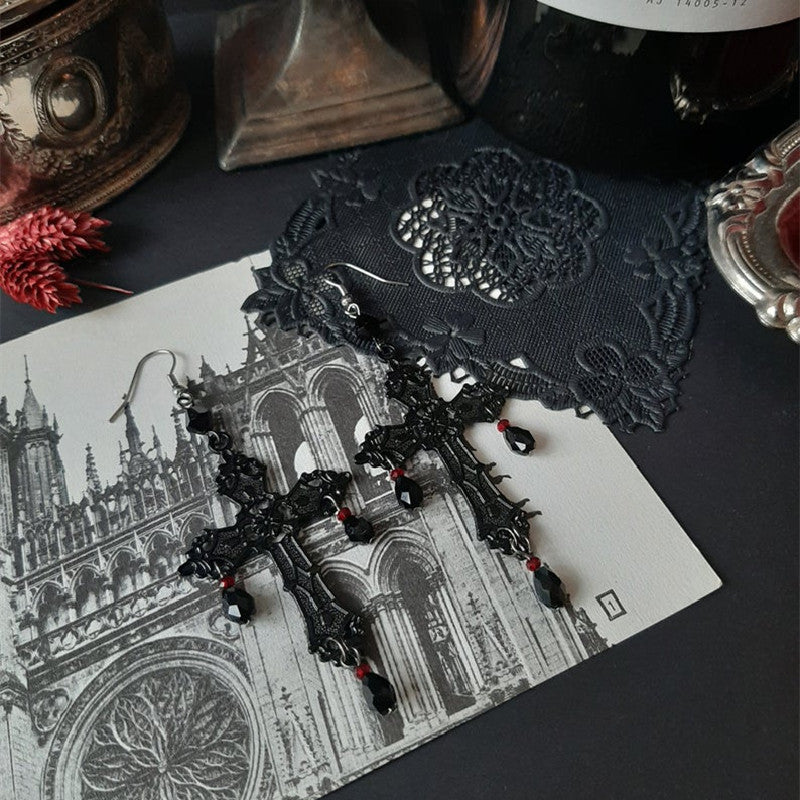 a pair of earrings on a table