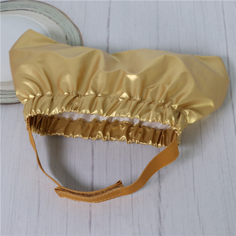 a gold cap on a white surface