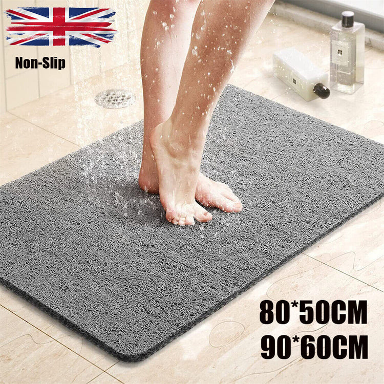 a person standing on a grey mat