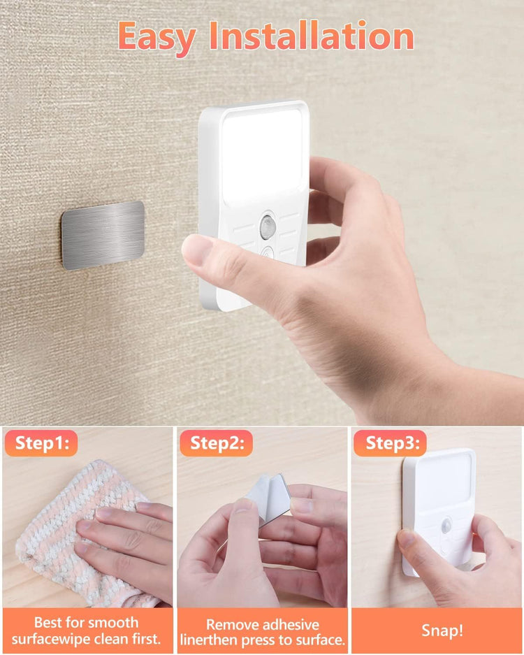 a person's hands holding a light switch