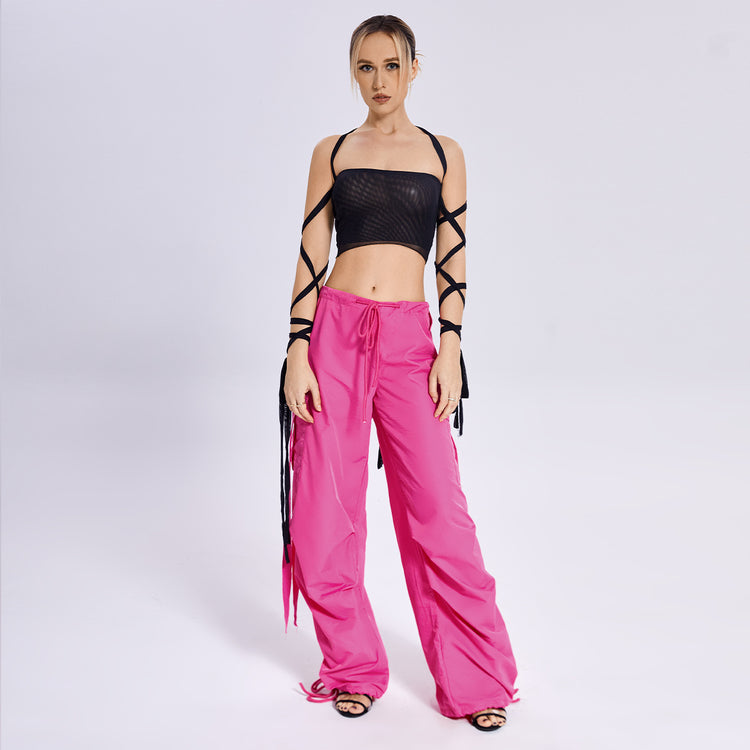 a woman in pink pants