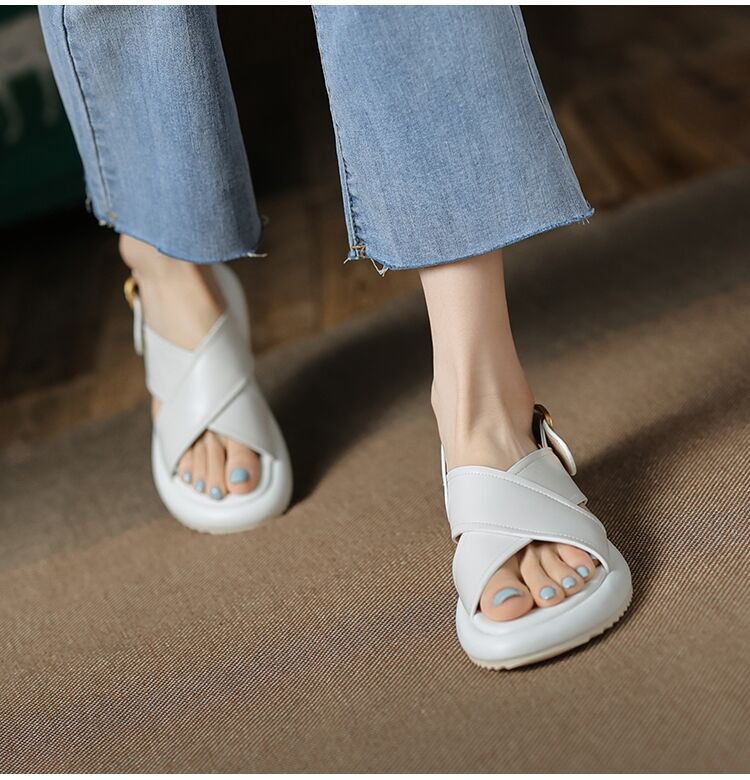 a person wearing white sandals