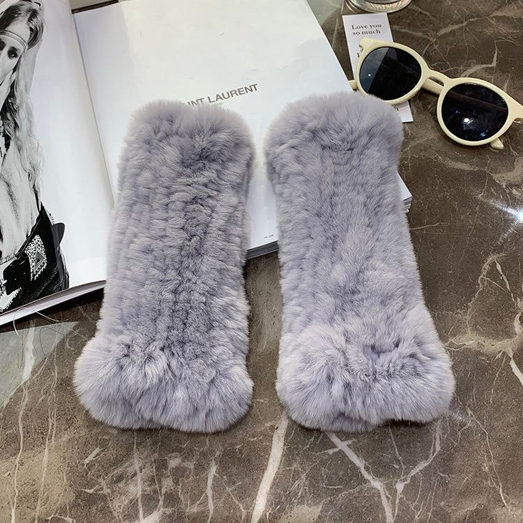 a pair of furry fur on a marble surface