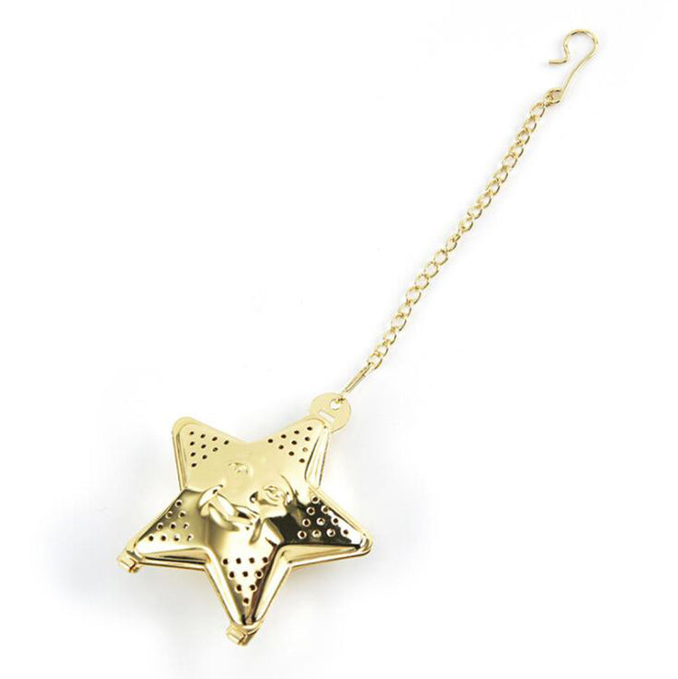 a gold star shaped tea strainer