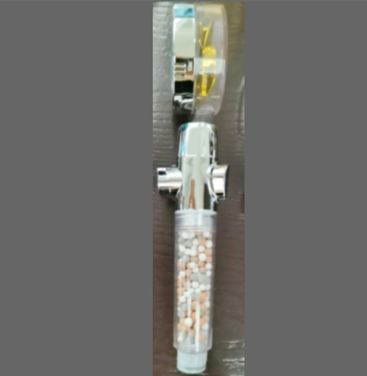 a water faucet with a clear plastic tube and a clear plastic container