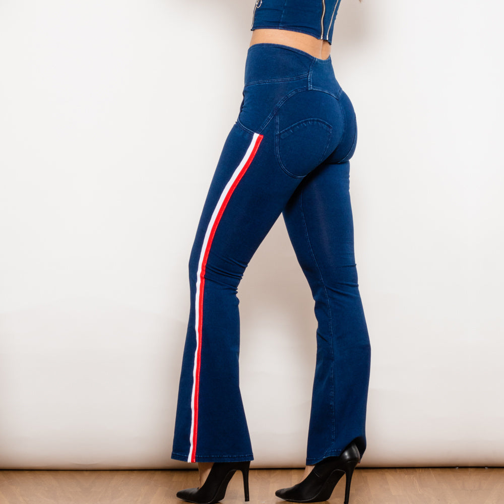 a woman wearing blue jeans and high heels