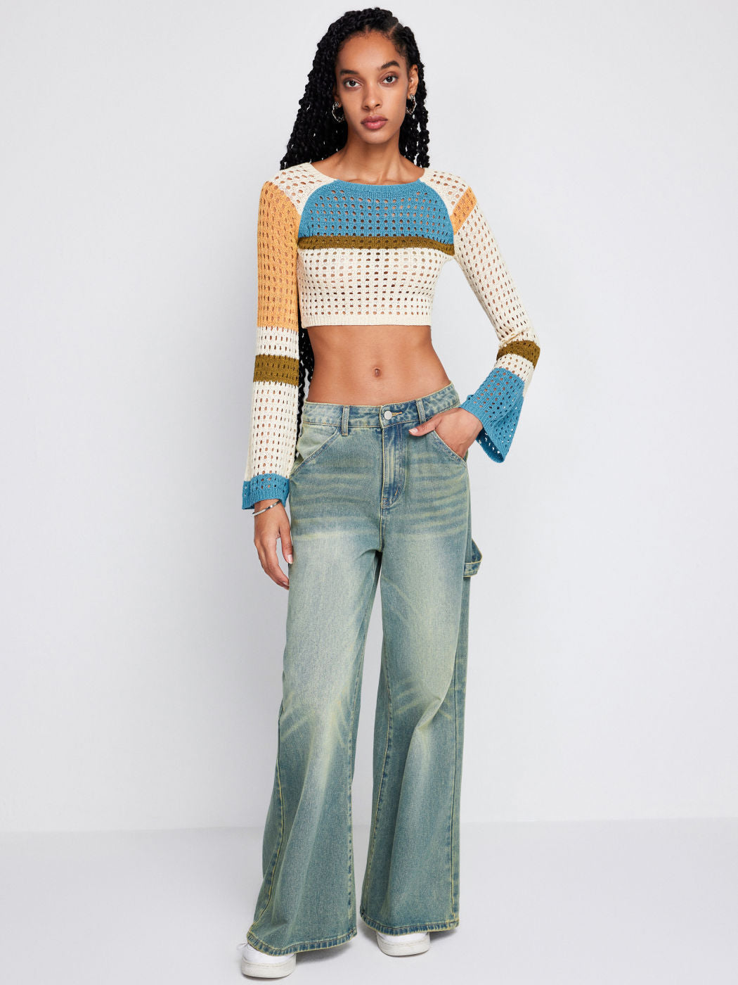 a woman in a sweater and jeans