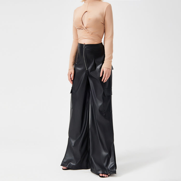 a woman in a black leather pants
