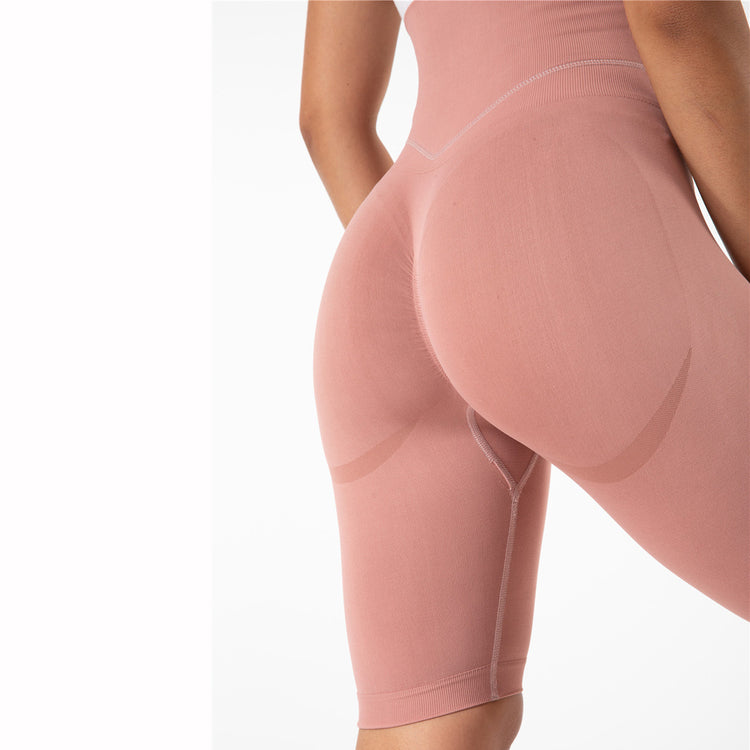 a woman wearing pink tights