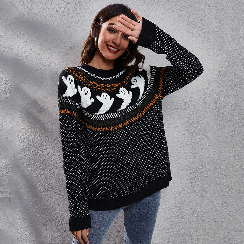 a woman wearing a sweater with ghosts on it