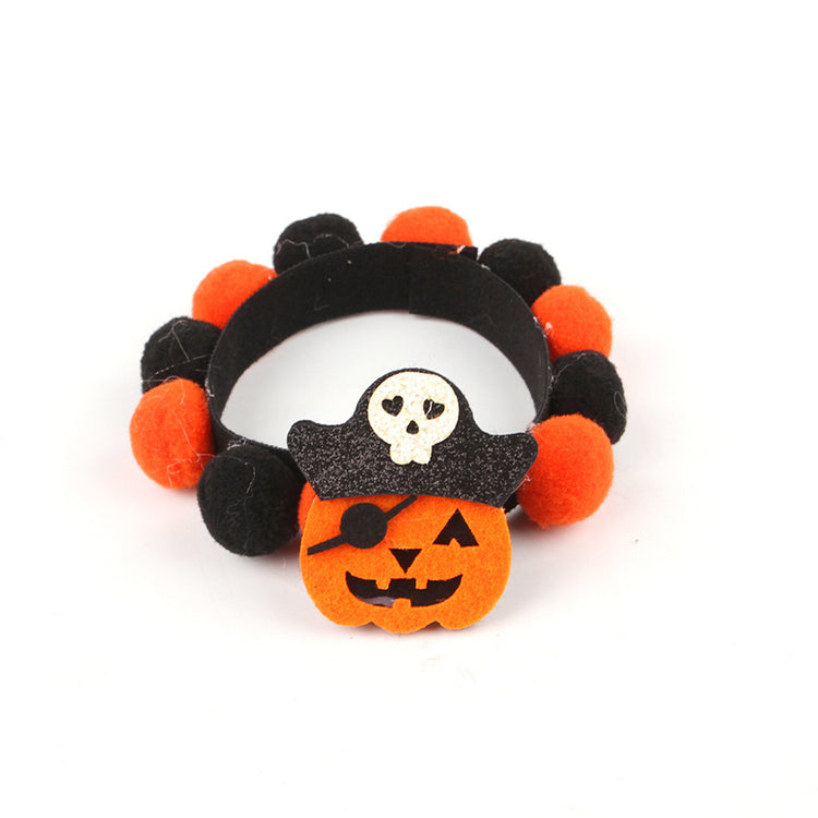 a bracelet with a pirate hat and a small pumpkin