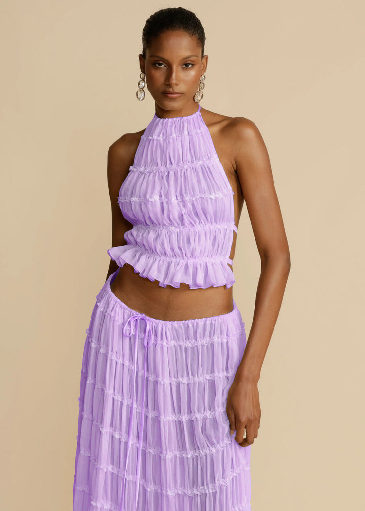 a woman in a purple dress