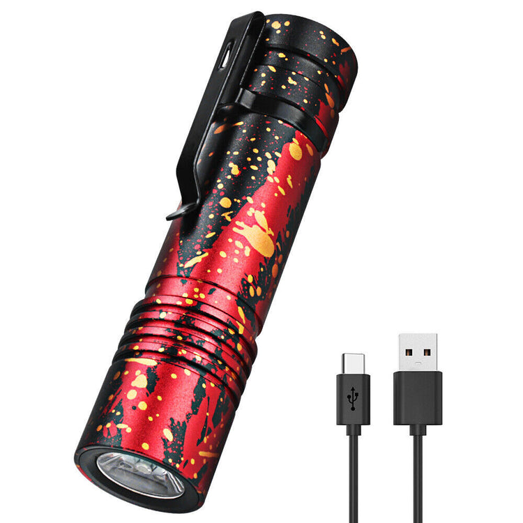 a red and black flashlight with a black handle and a black usb cable