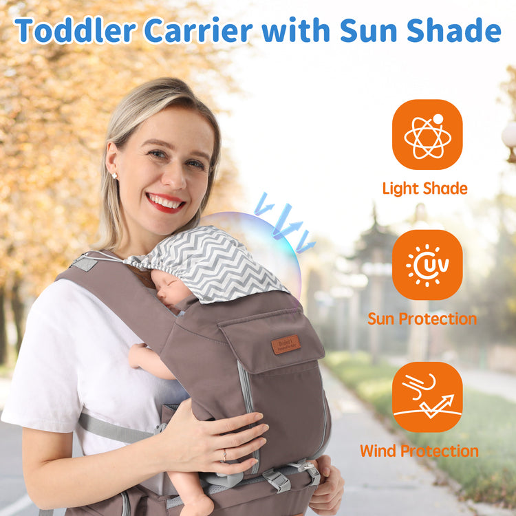 a woman carrying a baby in a carrier