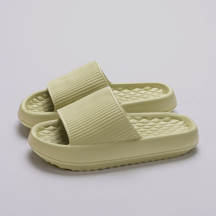 a pair of beige slippers