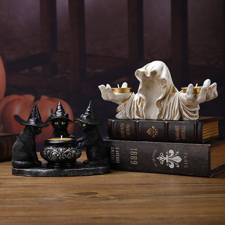 a group of black cats on top of books
