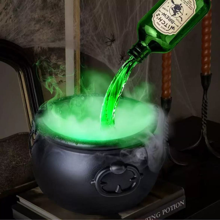 a green liquid being poured into a cauldron