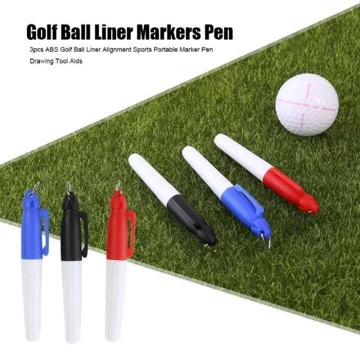 a group of markers on a green grass